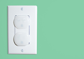 Electrical outlet with child safety plugs