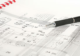pen laying on top of a schematic