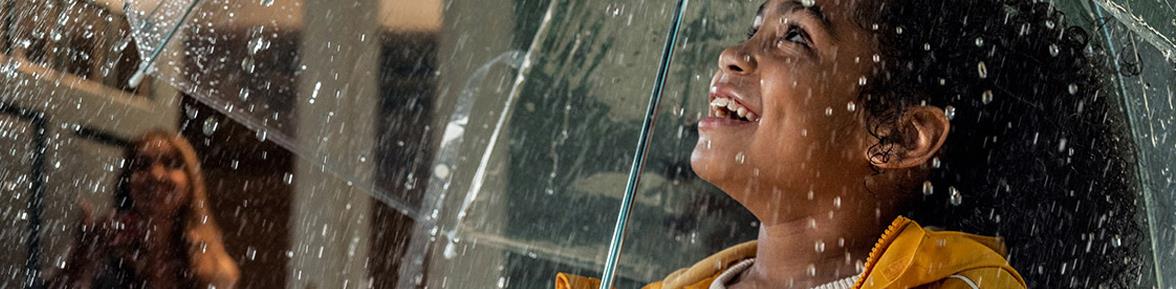 A mother reading her child a bedtime story on a tablet