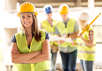 Female construction worker wearing hard hat