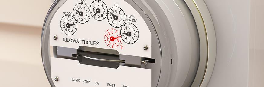 Closeup of electric meter mounted on a wall