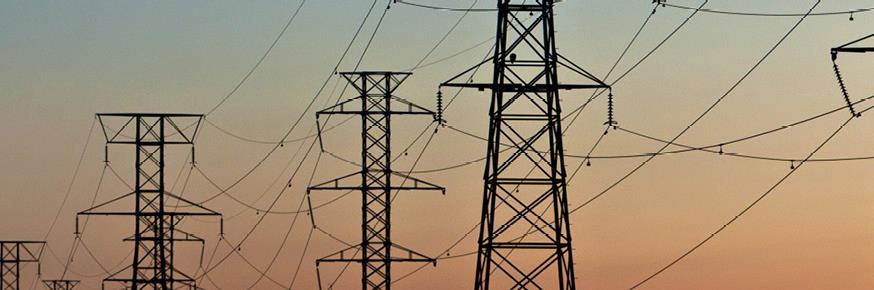 Power lines running through two metal towers
