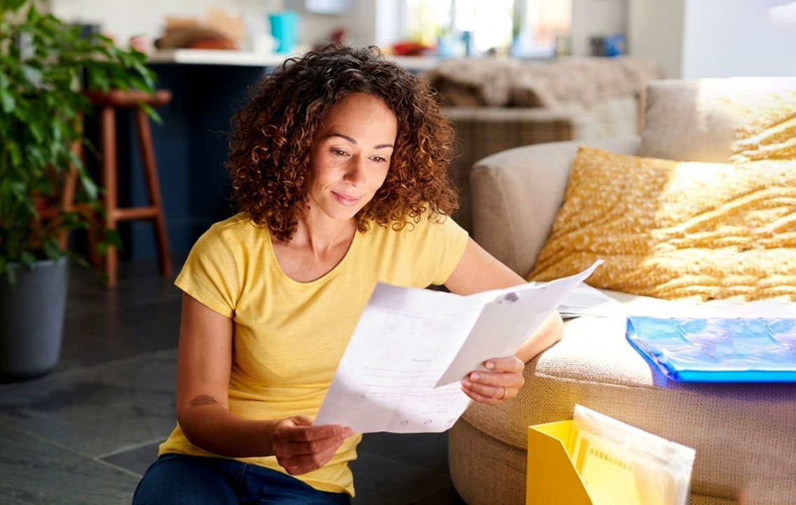 woman looking at bills