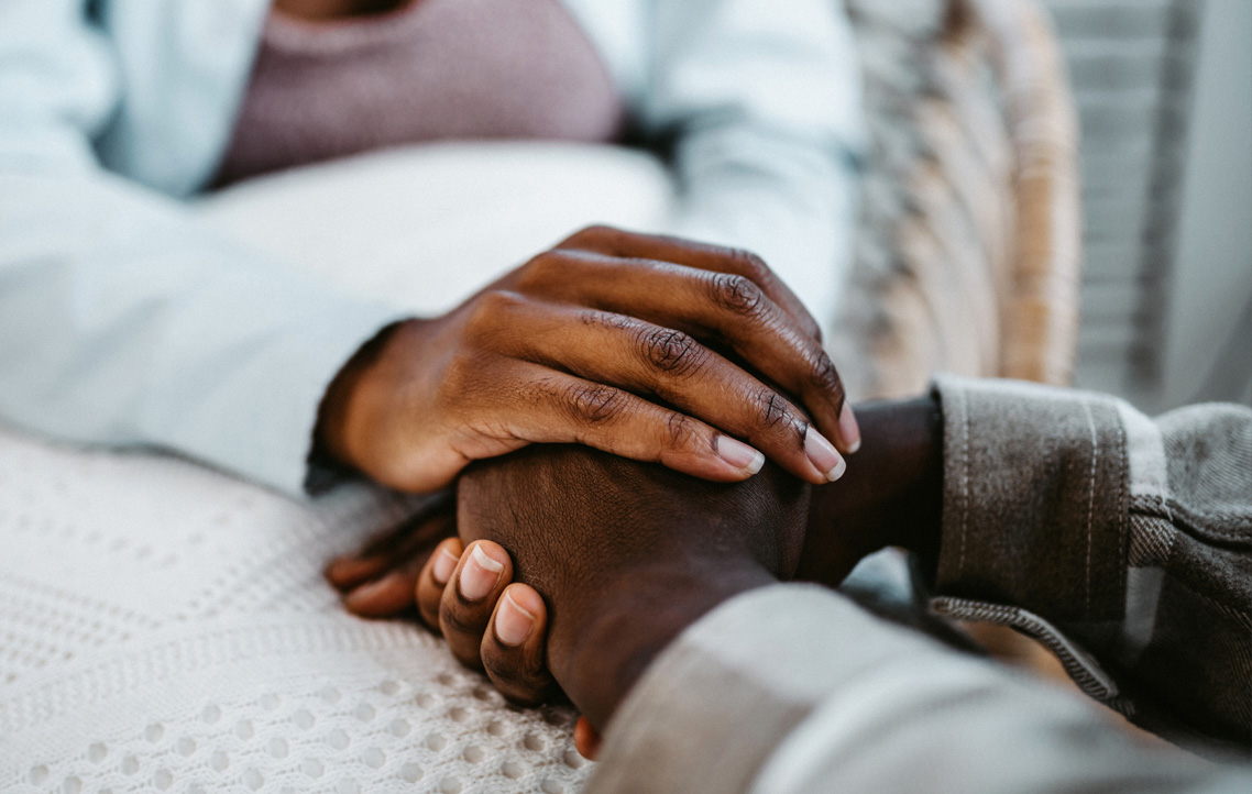 Couple holding hands