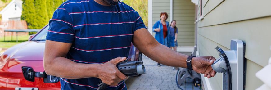 Man charging EV