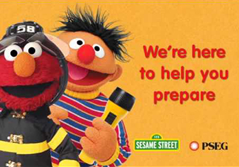 Ernie from Sesame Street holding a flashlight
