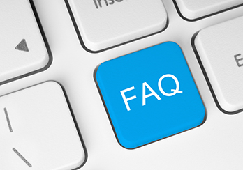 Closeup of blue FAQ button on computer keyboard