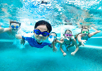 Children swimming under water