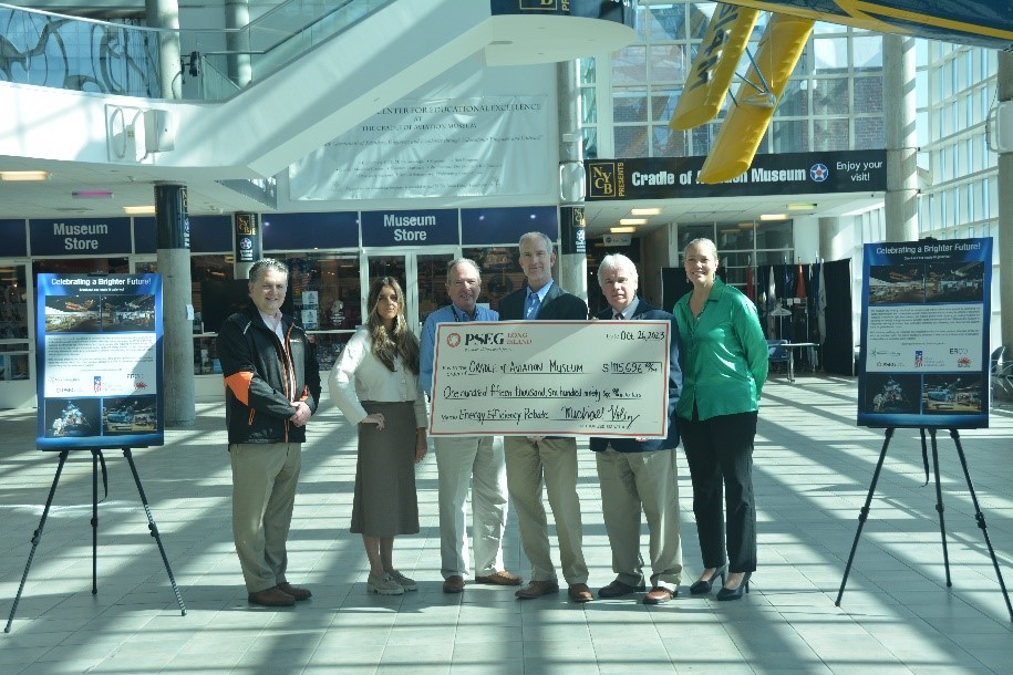 Pictured from left to right are: Chris Chaffee, Brittany Degel, Walter Hoefer and Michael Voltz of PSEG Long Island, and Andrew Parton and Jennifer Baxmeyer of the Cradle of Aviation Museum.