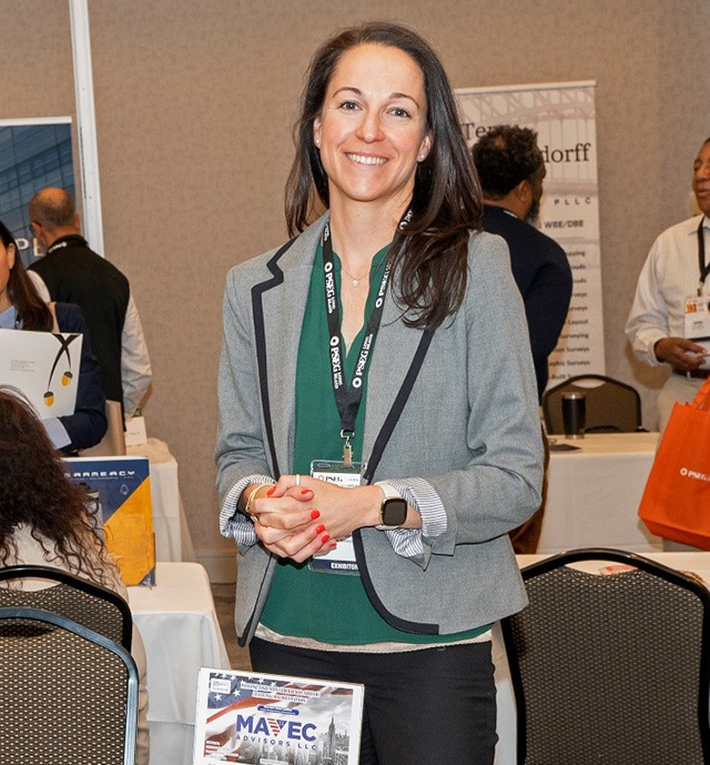 Cara Kazacs, a director at Wading River-based Mavec Advisors, staffs an exhibitor booth at the PSEG Long Island Supplier Diversity Fair on May 18.