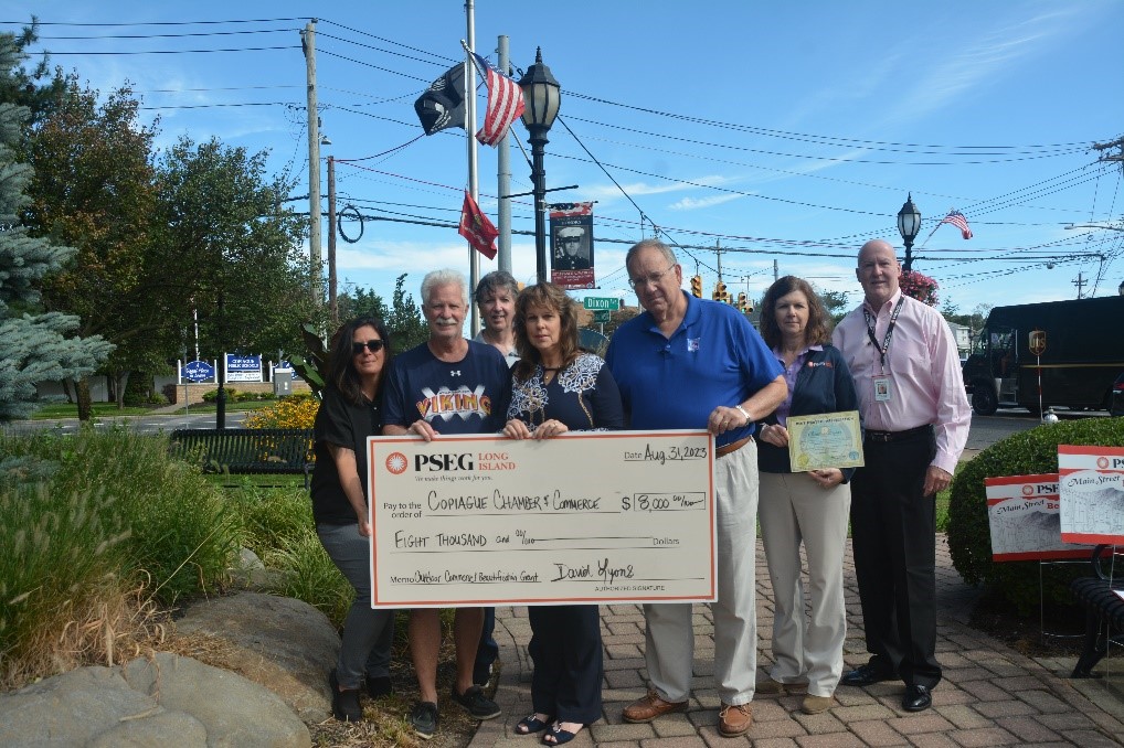 Pictured (from l-r): Dianne Garguilo, Peter Buccino, Robert Liquone, Donna Farina and Joseph Maguire, local business owners who are members of the Copiague Chamber of Commerce, with Christine Bryson and Reynold Vaughan of PSEG Long Island.
