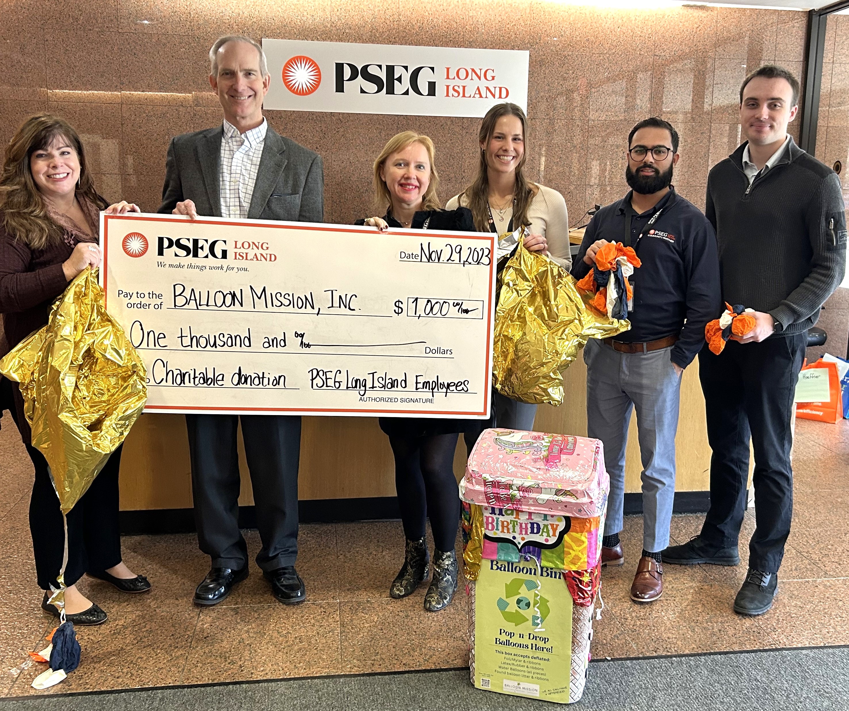 Pictured (l-r) behind balloon collection bin are: Cynthia Seibold, of Balloon Mission, Inc. and Michael Voltz, Anna Keselman, Gabriella Scibelli, Saqib Mandi, and Ronan Murphy, representing PSEG Long Island’s GREEN employee business resource group.