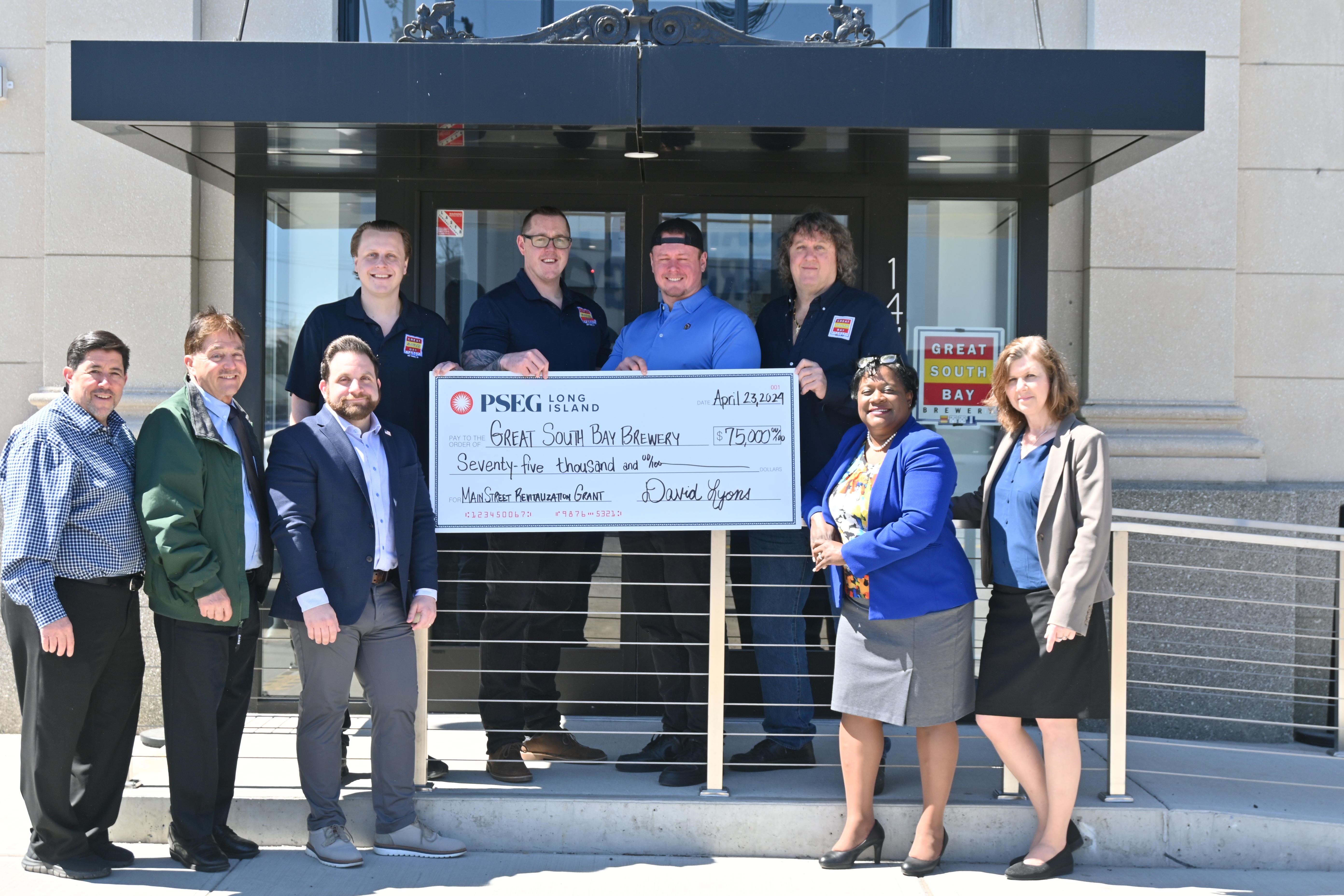 PSEG Long Island recently gave the owners of Great South Bay Brewery in Lindenhurst a $75,000 Main Street Revitalization grant. Members of Lindenhurst Village(left)  joined brewery  owners (top row) and PSEG Long Island (right) to celebrate. 