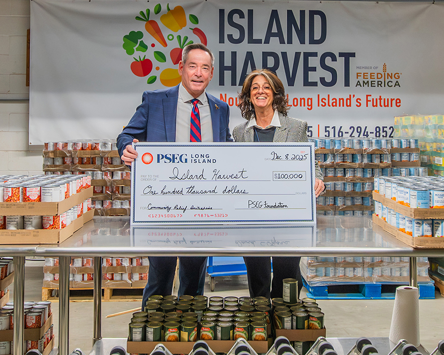 PSEG Long Island Interim President & COO David Lyons (l.) visits Island Harvest Food Bank President & CEO Randi Shubin Dresner following the PSEG Foundation’s announcement of a $100,000 grant to support the food bank’s efforts to combat food insecurity
