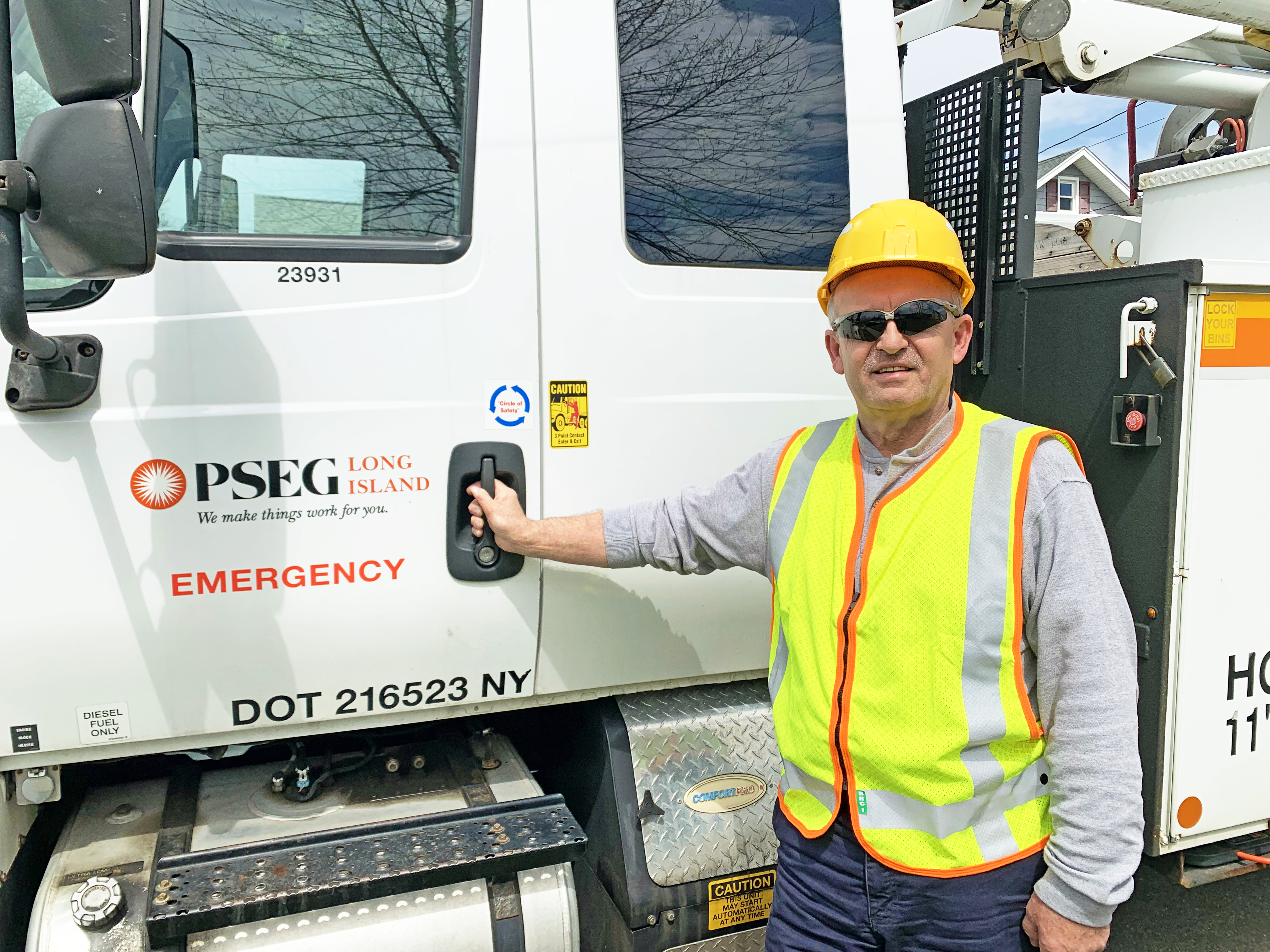Tony Kamycki, of Ronkonkoma, stands next to a PSEG Long Island work truck. Kamycki is one of hundreds of PSEG Long Island lineworkers who keep the lights on for approximately 1.2 million customers.