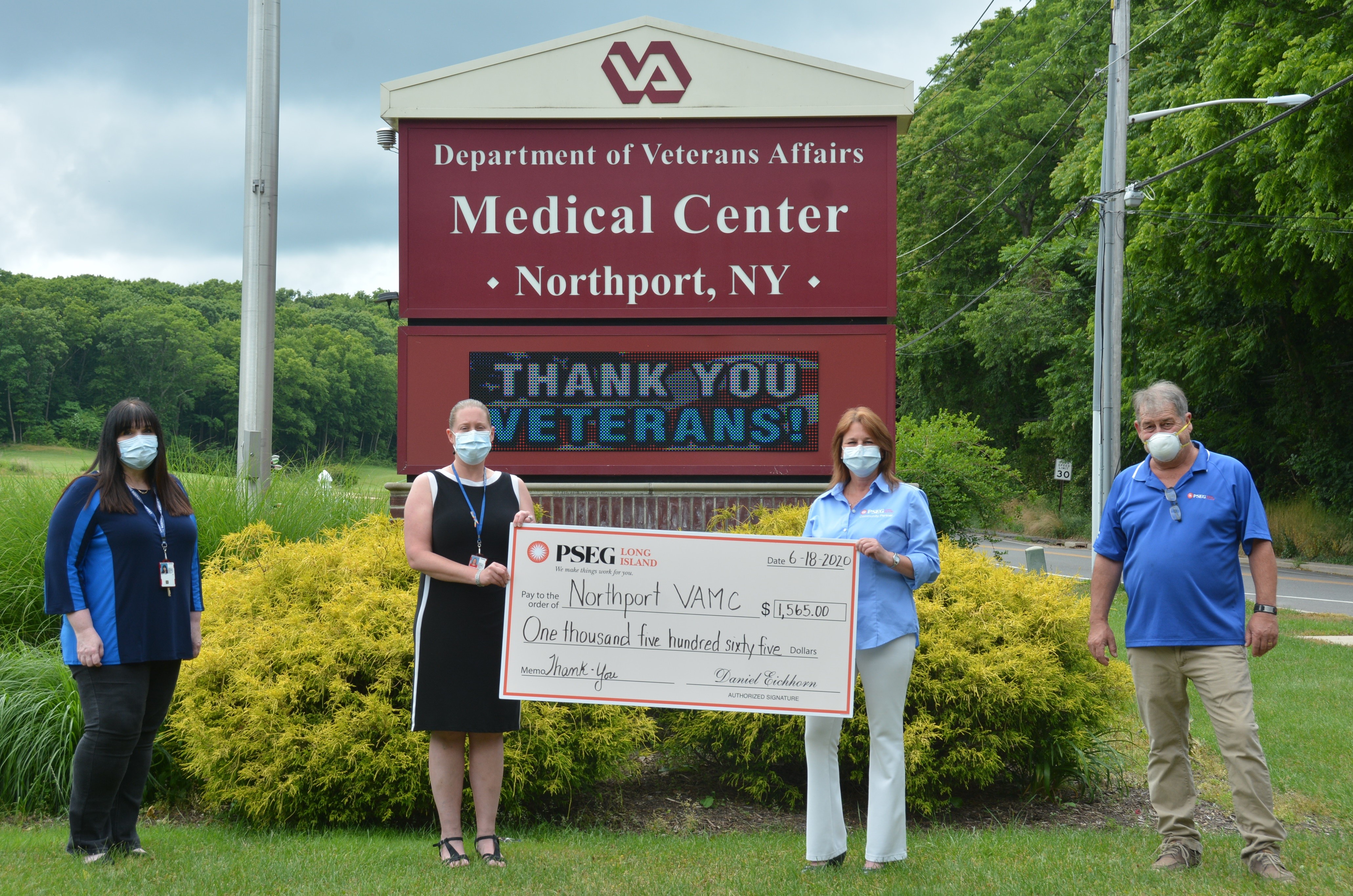 While socially distancing, Northport VAMC staff accepts ceremonial check representing $1,500 in gift cards donated by PSEG Long Island employees. The gift supports formerly homeless veterans by providing transportation to their lifesaving medical appointments. Pictured from left to right are: Northport VA’s Mary A. Kelly, LCSW, and Melanie Brodsky, LCSW, with PSEG Long Island’s Justine Sarni and Pete Hornick, who is a Northport resident.