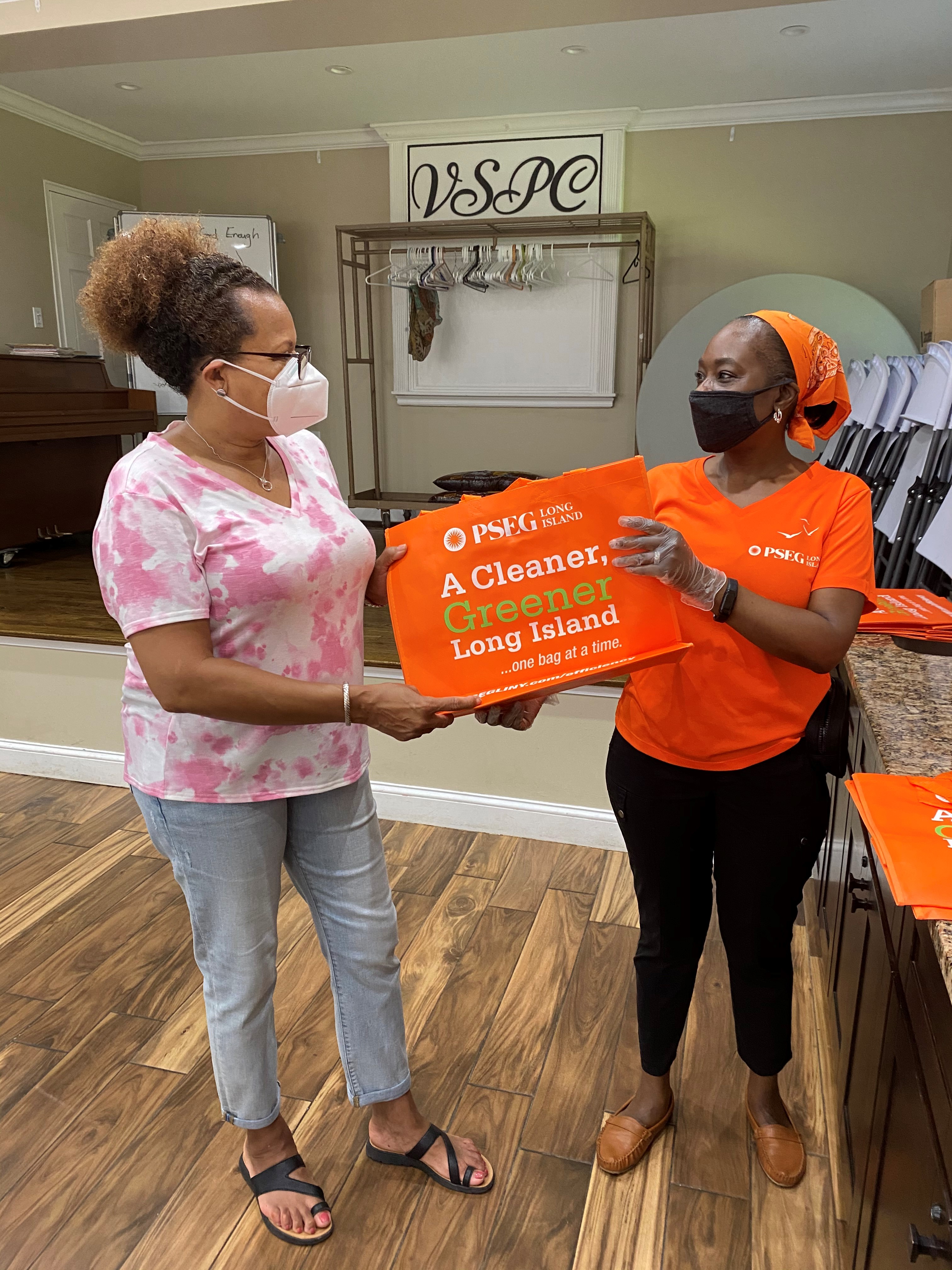 Valley Stream resident and PSEG Long Island employee Patricia Miles (right) helps Long Island Cares to dispense food boxes at her church to families who have become food insecure from the COVID-19 pandemic. Families are also given reusable bags donated by PSEG Long Island. The emergency food distribution takes place every Saturday from 10 a.m. – 2 p.m. at Valley Stream Presbyterian Church. It is open to all Nassau County residents on a first come, first served basis. Miles is pictured with fellow parishioner, Shaaron McFarland.