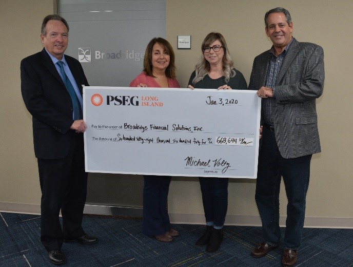 PSEG Long Island recently presented Broadridge Financial Solutions with a rebate check for $668,644 for making energy efficiency upgrades to its buildings over the past two years. Pictured (left to right) are PSEG Long Island’s Walter Hoefer, energy efficiency contract manager and Lauren Lian, major account consultant, along with Broadridge Financial Solutions’ Dana Milano, executive administrative assistant and Tom Ragolia, vice president of facilities & real estate.