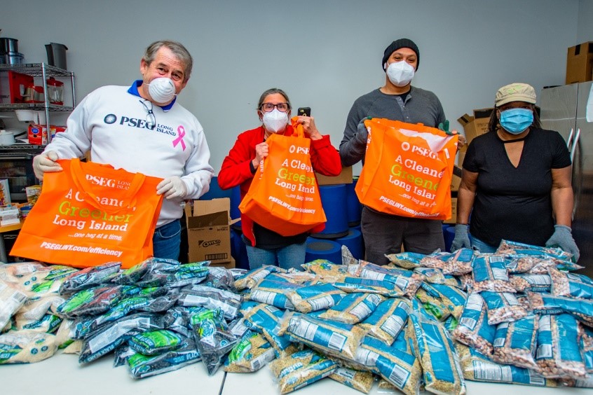 Shown from left to right are: PSEG Long Island’s Pete Hornick with Tri Community and Youth Agency Executive Director Debbie Rimler and social workers Martine MacDonald, and Linda Leake. The Tri CYA is distributing food in reusable bags donated by PSEG Long Island to members of the community who have become food insecure due to the pandemic. (additional photos are available)