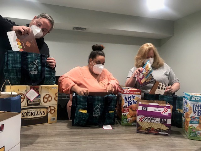 Employees of Ronald McDonald House Charities New York Metro (RMHC NYM), in New Hyde Park sort through the snacks and other grab-and-go food donated by PSEG Long Island for healthcare workers living at the facility. The groceries were provided to support nurses, doctors and other medical staff who are self-isolating from their families to keep them safe during the COVID-19 pandemic.