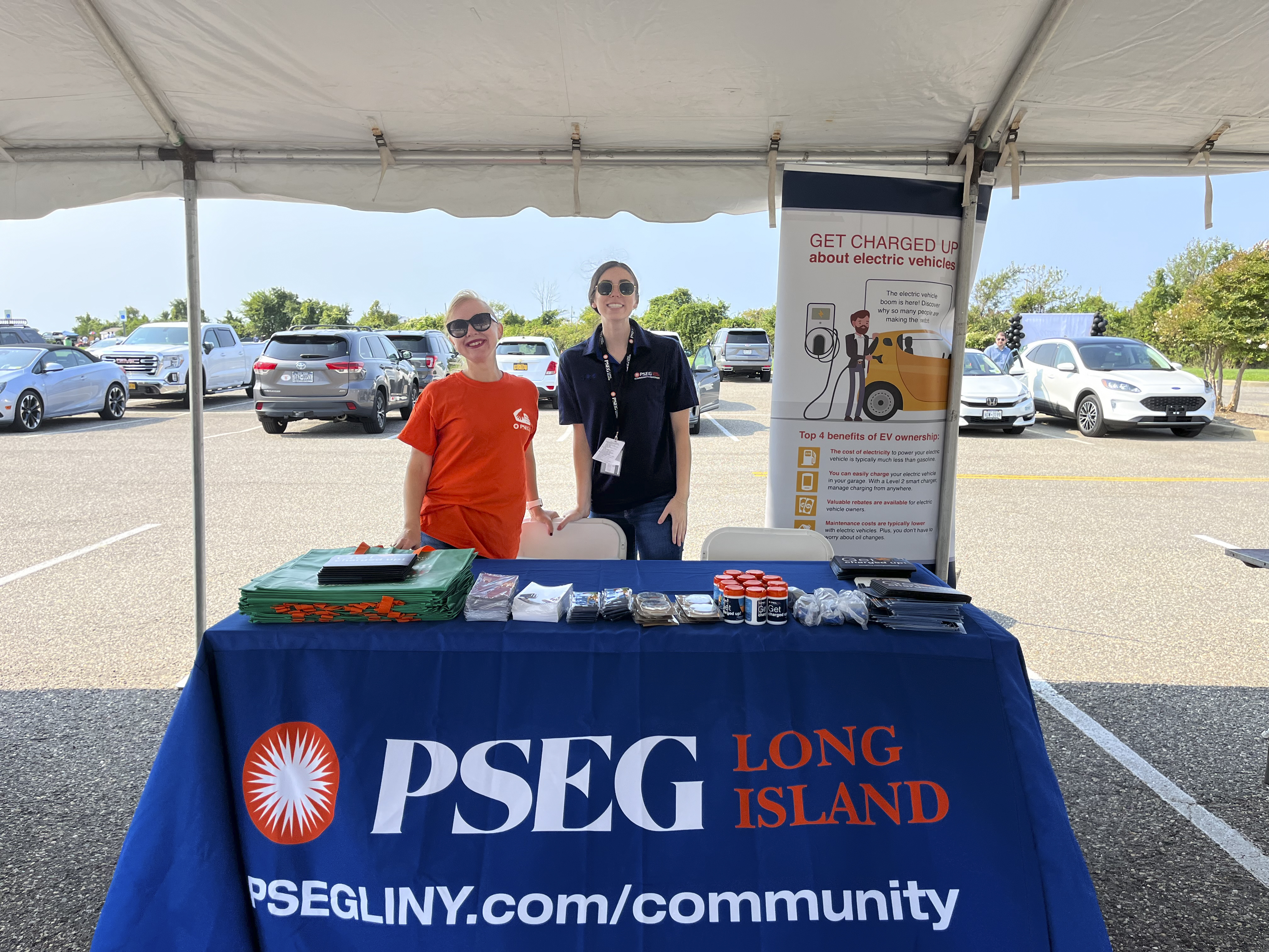 PSEG Long Island’s Anna Keselman (l.) and Shannon Hewlett staffed a booth at an electric vehicle showcase in Copiague to spread the word about the company’s incentives for electric vehicle chargers.