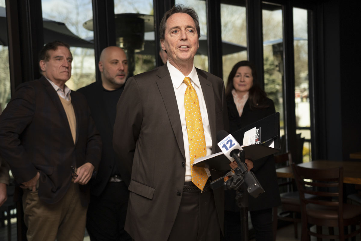PSEG Long Island's John Keating speaks to reporters at the Port Jeff Lobster House during the event announcing $500,000 in additional funding for PSEG Long Island's economic development grants.