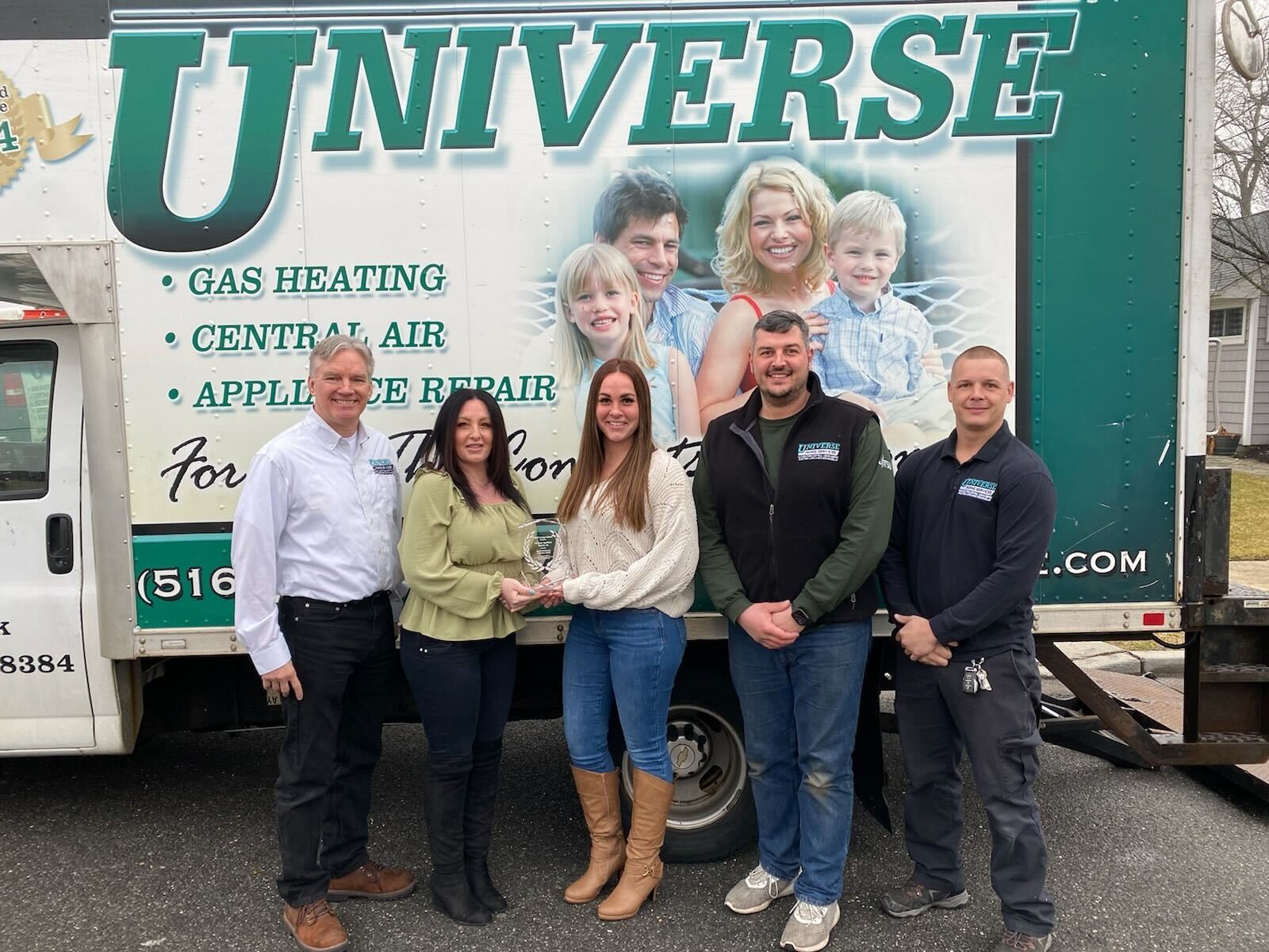 Pictured in front of one of their trucks (l-r) are: Bill Powell, Dawn Crowley, Taylor Papa, Jeffrey Schaefer and Scott Kelly of Universe Home Services.